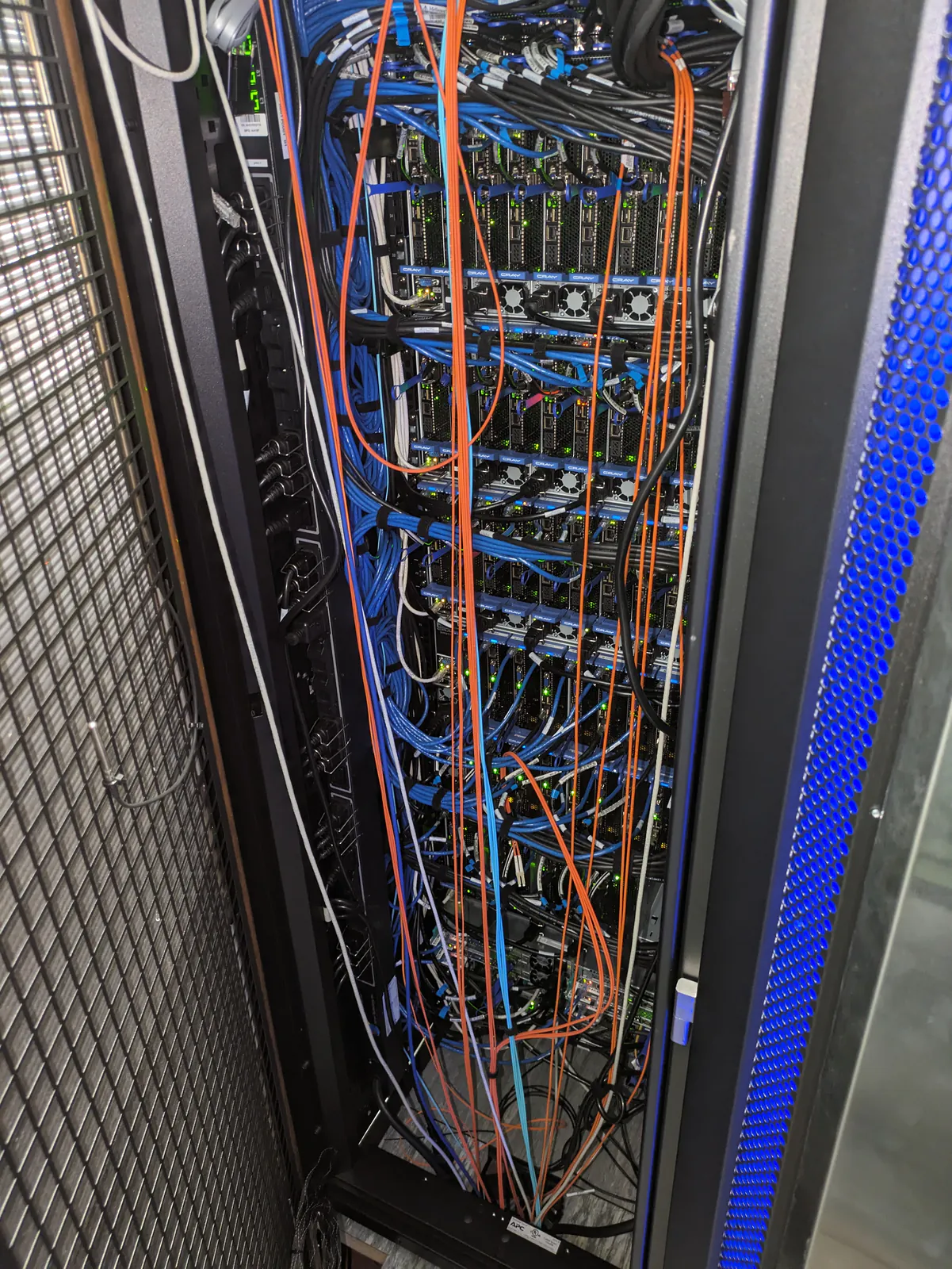 Rear server rack cabling being traced during fault diagnosis