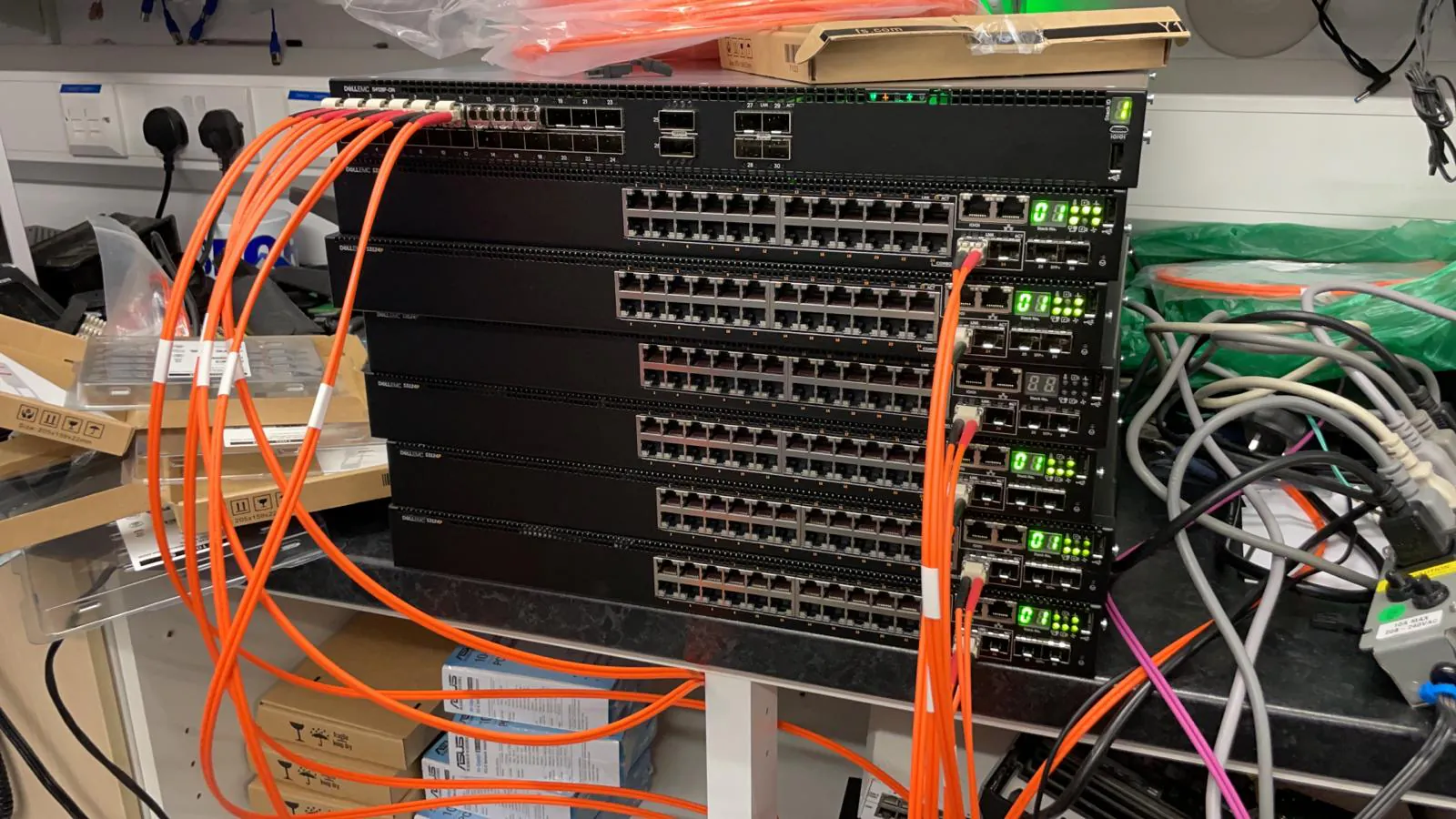 Network switches connected with fibre during bench testing